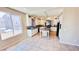 Spacious kitchen featuring tile floors, granite countertops, stainless steel sink, and ample cabinet space at 10716 Shasta Glow Ct, Henderson, NV 89052