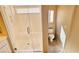 The bathroom has a glass-enclosed walk-in shower, toilet, and a small window at 10716 Shasta Glow Ct, Henderson, NV 89052