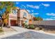 Lovely two-story house with a garage, manicured front yard, and easy driveway access at 11094 Arcadia Sunrise Dr, Henderson, NV 89052