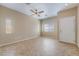 Bright living room featuring neutral walls, tile flooring, and natural light at 11094 Arcadia Sunrise Dr, Henderson, NV 89052