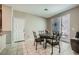 Cozy dining room featuring tiled floors and access to the outdoor living space at 1111 Frye Mesa Ave, North Las Vegas, NV 89086