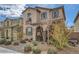 Two-story house featuring a cute balcony, decorative shutters, and desert landscaping at 1111 Frye Mesa Ave, North Las Vegas, NV 89086