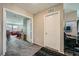 Hallway with open doorway to a living area and a door to an office space at 1111 Frye Mesa Ave, North Las Vegas, NV 89086