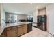 Modern kitchen with granite countertops and stainless steel appliances overlooking the Gathering room at 1111 Frye Mesa Ave, North Las Vegas, NV 89086