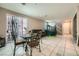 Open-concept living and dining area filled with natural light from a sliding glass door at 1111 Frye Mesa Ave, North Las Vegas, NV 89086