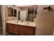 Bathroom with double sink vanity, modern fixtures, and a large mirror at 1147 Light Sky Ave, Henderson, NV 89074