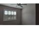 Bedroom with a ceiling fan and a shuttered window for natural light control at 1147 Light Sky Ave, Henderson, NV 89074