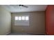 Spacious bedroom with neutral walls, ceiling fan, and window with shutters at 1147 Light Sky Ave, Henderson, NV 89074