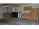 Spacious garage with ample storage, including cabinets and shelving at 1147 Light Sky Ave, Henderson, NV 89074