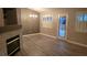 Living room showcases modern light fixture, plantation shutters and a decorative fireplace at 1147 Light Sky Ave, Henderson, NV 89074