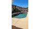 Relaxing backyard pool with lush greenery and well-maintained landscaping, perfect for outdoor enjoyment at 1147 Light Sky Ave, Henderson, NV 89074