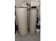 Culligan water softener system with white tanks and some painting supplies nearby at 1147 Light Sky Ave, Henderson, NV 89074