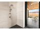 This bathroom features a modern shower with a desert view, luxurious fixtures, and a sleek design at 11660 Summit Club Dr # 204, Las Vegas, NV 89135