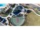 Aerial view showcasing a park with a pool, playground, gazebo, and basketball court, perfect for community activities at 12237 Plum Mist Ct # 4, Las Vegas, NV 89183