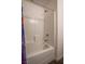 Bright white tiled shower and tub combination with modern fixtures at 12237 Plum Mist Ct # 4, Las Vegas, NV 89183