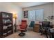 Bedroom with desk, chair and bookcase, offering a bright workspace at 12237 Plum Mist Ct # 4, Las Vegas, NV 89183