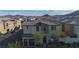 An aerial view of a two story home nestled within a community surrounded by mountain views at 12237 Plum Mist Ct # 4, Las Vegas, NV 89183