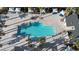 Top-down view of a community pool with palm trees, lounge seating, and shade coverings at 12237 Plum Mist Ct # 4, Las Vegas, NV 89183