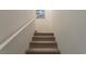 Carpeted stairs with white railing leading to upper level, bright and clean design at 12237 Plum Mist Ct # 4, Las Vegas, NV 89183