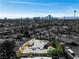 A greyscale aerial view of a home with landscaping, pool, and a view of the Las Vegas skyline at 1409 Bonita Ave, Las Vegas, NV 89104