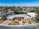 Charming single-story home with a two-car garage, desert landscaping and mountain views, captured from above at 1409 Bonita Ave, Las Vegas, NV 89104