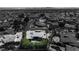 A greyscale aerial view of a desert home with palm trees, landscaping, and pool at 1409 Bonita Ave, Las Vegas, NV 89104