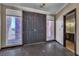 Inviting foyer with a double-door entrance, neutral walls, and stylish tile flooring leading to other rooms at 1409 Bonita Ave, Las Vegas, NV 89104