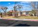 Cozy home exterior with mature landscaping, well-maintained lawn, and a charming, tree-lined street at 1409 Bonita Ave, Las Vegas, NV 89104