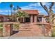 Home with a brick walkway, manicured landscaping, and a charming facade, exuding curb appeal at 1409 Bonita Ave, Las Vegas, NV 89104