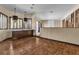 Spacious living room area with wood floors, built in shelving, and ample natural light at 1409 Bonita Ave, Las Vegas, NV 89104