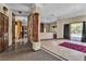 Spacious living room with tile floors, a decorative pillar, and sliding glass doors leading to the backyard at 1409 Bonita Ave, Las Vegas, NV 89104