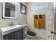 Updated bathroom featuring a modern vanity and decorative geometric wall accents at 1417 Joshua Way, Las Vegas, NV 89101