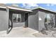 Close up of a home entrance showing storm door, exterior paint and landscaping at 1417 Joshua Way, Las Vegas, NV 89101