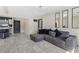 Stylish living area with a tiled floor, decorative mirrors and seamless transition to the kitchen at 1417 Joshua Way, Las Vegas, NV 89101