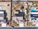 Birds eye view of a home with solar panels, landscaped backyard, RV parking and swimming pool at 150 Spruce Ln, Pahrump, NV 89048