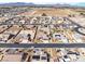 Wide aerial shot showcasing a residential neighborhood with various homes, pools, and desert landscaping at 150 Spruce Ln, Pahrump, NV 89048