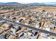 Expansive aerial view of a suburban neighborhood featuring single-Gathering homes and mountain views at 150 Spruce Ln, Pahrump, NV 89048