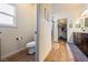 Bathroom with a toilet and a view of the shower and walk in closet at 150 Spruce Ln, Pahrump, NV 89048