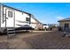 An RV parked in the driveway of this home with mountain views at 150 Spruce Ln, Pahrump, NV 89048