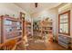 Well-lit living room offers plenty of space with built in shelving units and a view of the dining area at 150 Spruce Ln, Pahrump, NV 89048