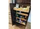 Kitchen pantry with pull out shelves provides organized storage for food and cooking supplies at 150 Spruce Ln, Pahrump, NV 89048