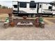 Cozy outdoor patio with a firepit and RV views at 150 Spruce Ln, Pahrump, NV 89048