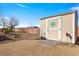 A shed with a decorative door in the desert landscaped backyard at 150 Spruce Ln, Pahrump, NV 89048