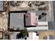 An aerial view of the property showcasing the expansive, enclosed backyard, large driveway, and desert landscape at 2080 Mount Charleston Dr, Pahrump, NV 89048