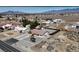 Neighborhood of single story homes with desert landscaping and views of snow capped mountains in the distance at 2080 Mount Charleston Dr, Pahrump, NV 89048