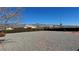 This backyard offers gravel landscaping with mountain views at 2080 Mount Charleston Dr, Pahrump, NV 89048