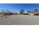 Large backyard with decorative landscaping and a storage shed at 2080 Mount Charleston Dr, Pahrump, NV 89048