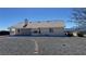 Single-story home's backyard features a desert xeriscape, covered patio, and mountain views at 2080 Mount Charleston Dr, Pahrump, NV 89048