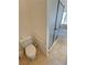 Neutral bathroom featuring a toilet, and glass enclosed walk in shower at 2080 Mount Charleston Dr, Pahrump, NV 89048