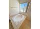 Corner soaking tub under a bright window at 2080 Mount Charleston Dr, Pahrump, NV 89048